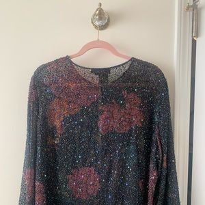 Sheer jacket with sequins. One hook and eye closure. Never worn.